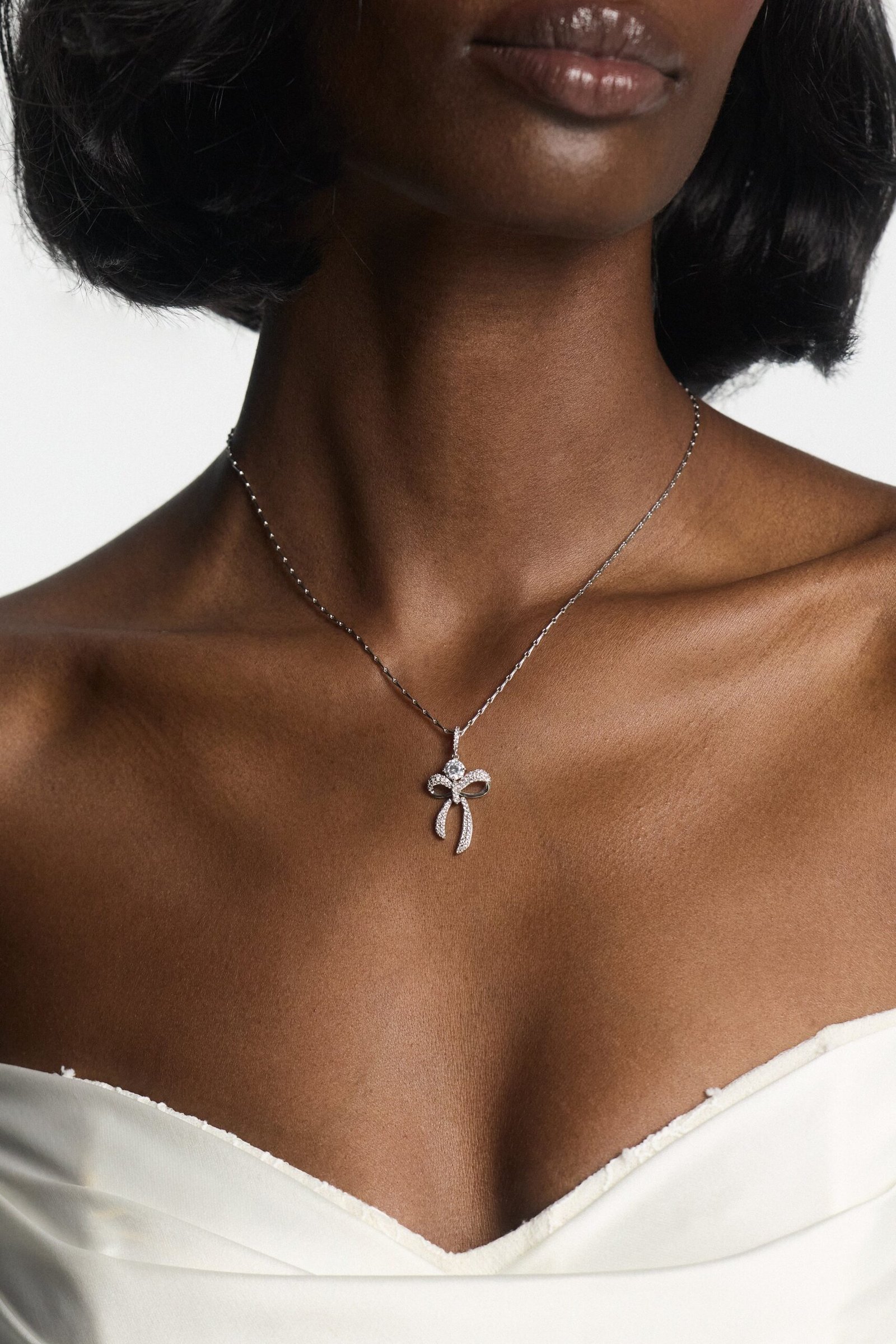 EROS BOW AND CZ PENDANT NECKLACE - Image 2